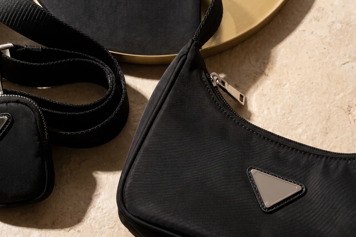 Close detail of the nylon weave and strap on a black Prada nylon bag