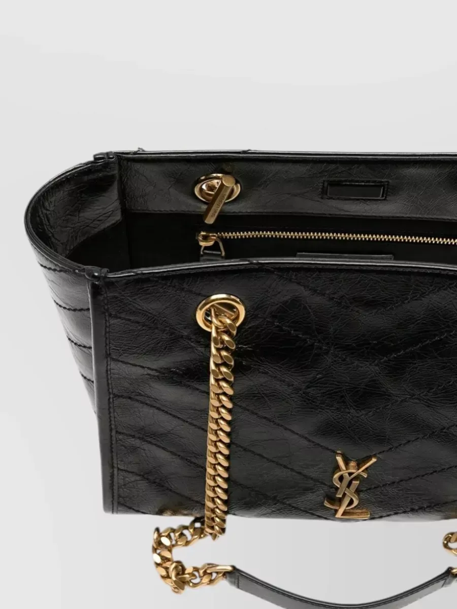 Saint Laurent Niki Small Nera, hardware color bronzo e logo Cassandre
