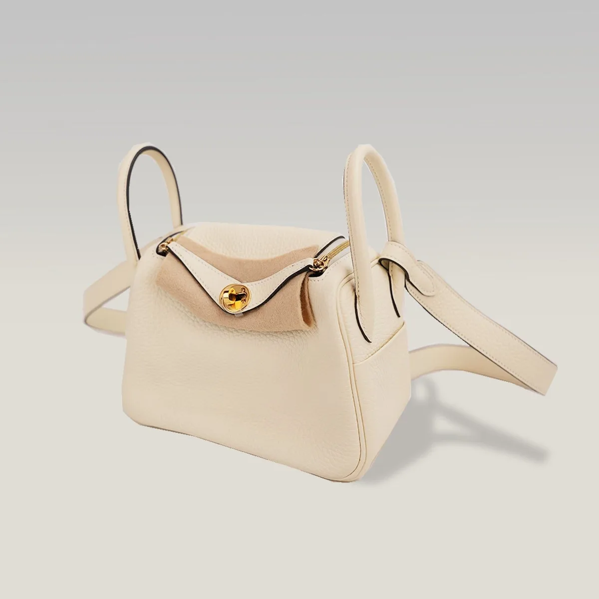 Hermès Mini Lindy 20 in Milkshake White leather with gold hardware and crossbody strap